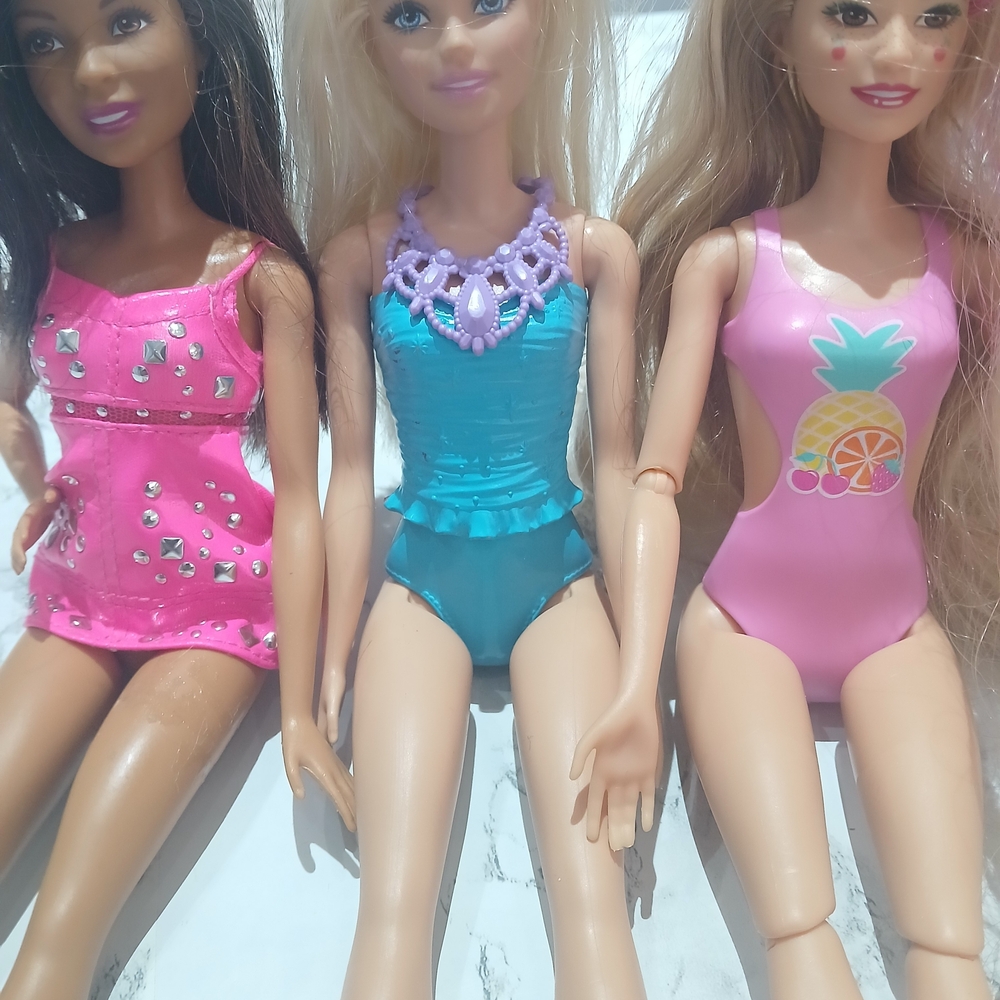Glamour Doll Trio with Pink, Blue, and Purple Swimsuits